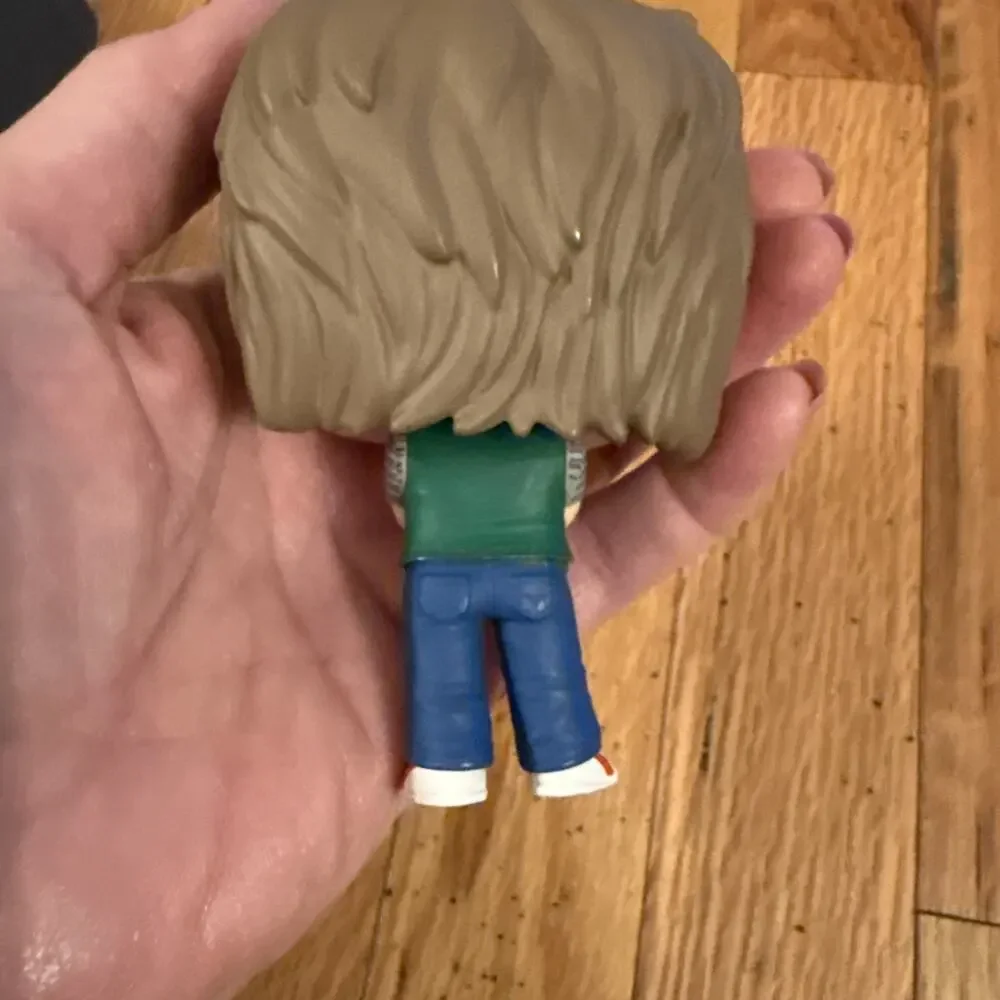Funko Pop! Figure with Brown Hair, Cream Face, Green Vest, Blue Pants - Picture 4 of 7